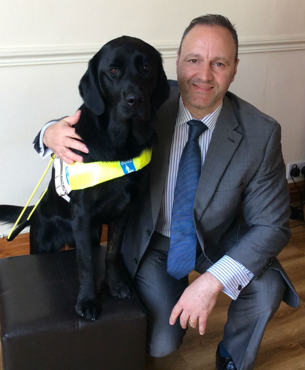 Photo of Steven and his guide dog Questa