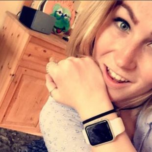 A photograph of Molly Watt with an Apple Watch