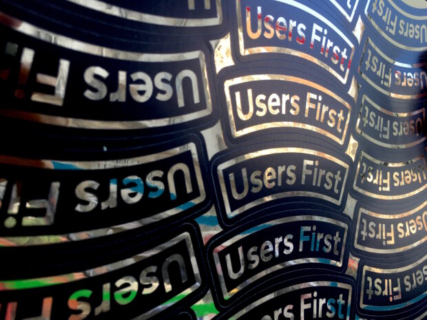 A sheet of stickers saying 'users first'