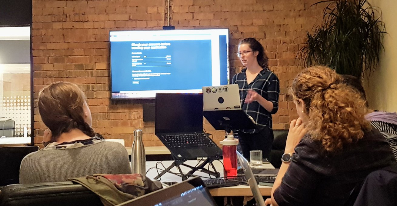 Beverley presenting website to an audience at Front End Sheffield