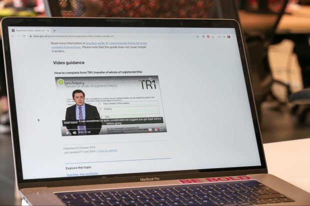 Laptop showing a video player on a GOV.UK page