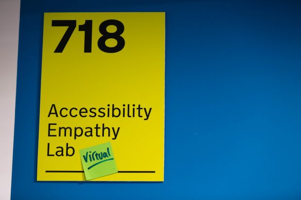 Accessibility Empathy Lab sign with sticky note which says ‘virtual’ on it.