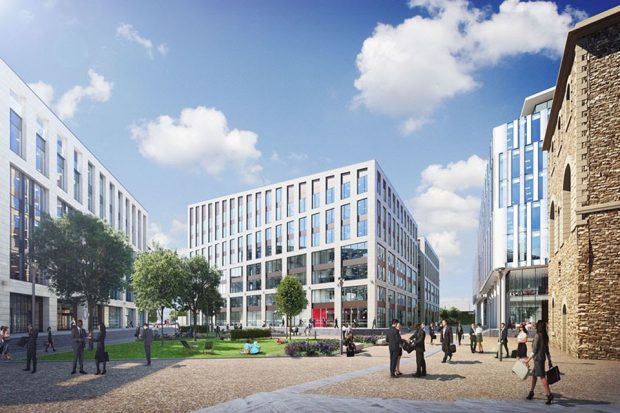 Office blocks surrounding a tree-lined people-filled square on a sunny day with fluffy clouds