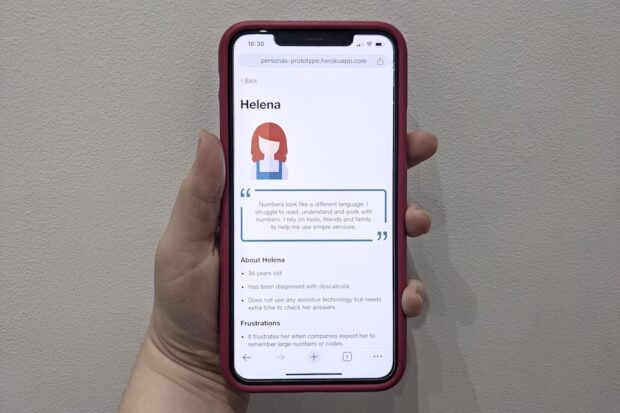 Image of the Helena persona on an iPhone. The quote reads: 'Numbers look like a different language. I struggle to read, understand and work with numbers. I rely on tools, friends and family to help me use simple services.